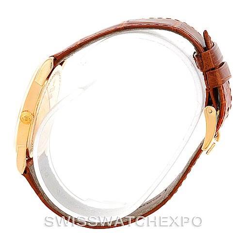 The image shows a Rolex Cellini 5116 Men's Yellow Gold Champagne Dial 5116 Men's Yellow Gold Champagne Dial watch from a side angle, highlighting its brown leather strap and gold casing.