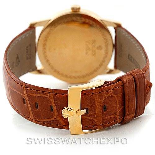 The image shows the back of a Rolex Cellini 5116 Men's Yellow Gold Champagne Dial 5116 Men's Yellow Gold Champagne Dial watch with a focus on its leather strap and buckle.