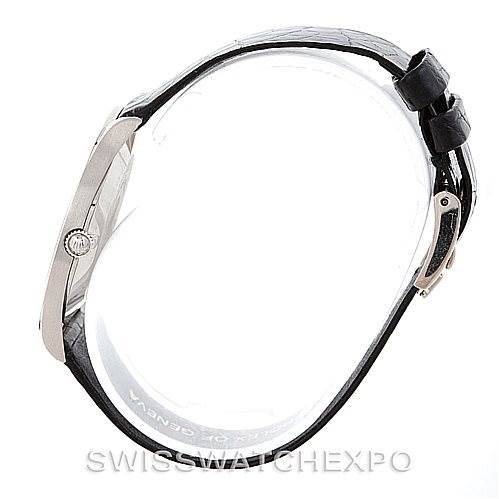 This side view of the Rolex Cellini 4133 Men's White Gold White Dial 4133 Men's White Gold White Dial watch shows the profile, crown, and strap with a buckle.