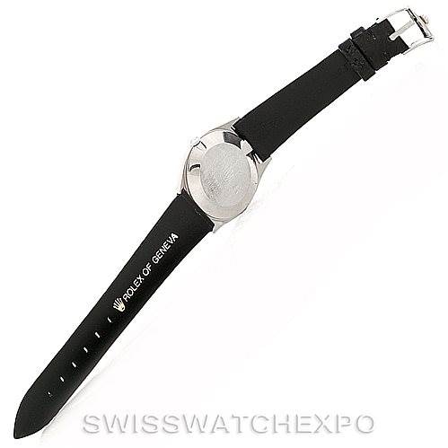 The image shows the Rolex Cellini 4133 Men's White Gold White Dial 4133 Men's White Gold White Dial watch from a top view, focusing on the back case and the leather strap.