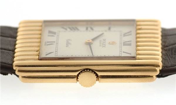 The image shows a side view of the Rolex Cellini 4016 Men's Yellow Gold White Dial 4016 Men's Yellow Gold White Dial watch, focusing on the crown and rectangular gold case.