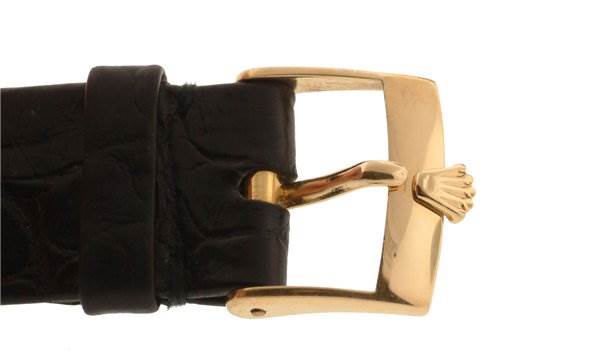 A close-up of the buckle and strap of a Rolex Cellini 4016 Men's Yellow Gold White Dial 4016 Men's Yellow Gold White Dial watch, featuring a gold clasp with the Rolex logo.