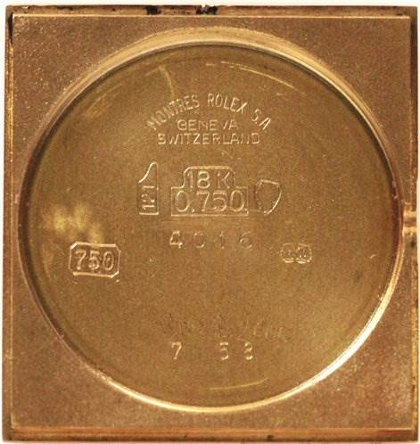 This image shows the interior of the case back of a Rolex Cellini 4016 Men's Yellow Gold White Dial 4016 Men's Yellow Gold White Dial watch, highlighting inscriptions and hallmarks.