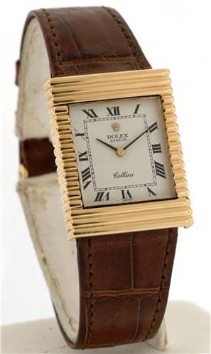 The image shows a Rolex Cellini 4012 Men's Yellow Gold White Dial 4012 Men's Yellow Gold White Dial watch from a front angle, showcasing its rectangular gold bezel, white dial with Roman numerals, and brown leather strap.