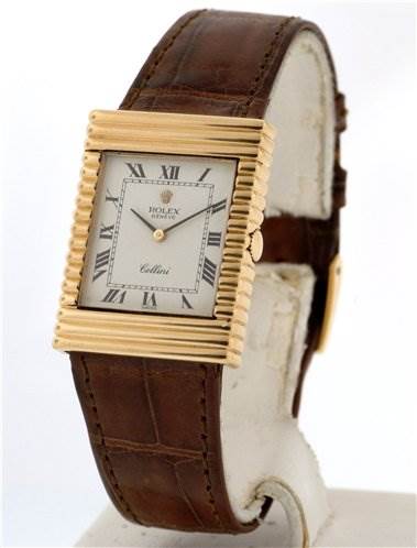 The image shows a Rolex Cellini 4012 Men's Yellow Gold White Dial 4012 Men's Yellow Gold White Dial watch at an angled side view, displaying the rectangular face and brown leather strap.