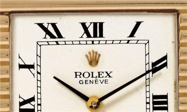 This close-up image shows the dial of a Rolex Cellini 4012 Men's Yellow Gold White Dial 4012 Men's Yellow Gold White Dial watch featuring Roman numerals and the Rolex logo.