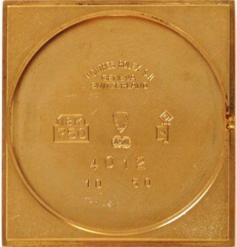 This image shows the back cover of a Rolex Cellini 4012 Men's Yellow Gold White Dial 4012 Men's Yellow Gold White Dial watch, displaying engraved details and markings.