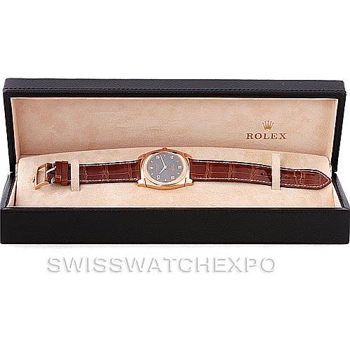 The Rolex Cellini 5330 Men's Rose Gold Grey Dial 5330 Men's Rose Gold Grey Dial watch is shown from a top-down angle inside its branded box, displaying its face and leather strap.