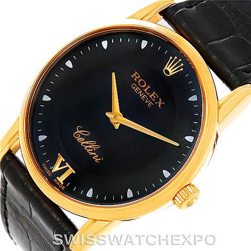 The image shows a close-up angle of the Rolex Cellini 5116 Men's Yellow Gold Black Dial 5116 Men's Yellow Gold Black Dial watch face, crown, and part of the black leather strap.