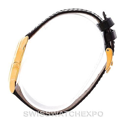 This is a side view of a Rolex Cellini 5116 Men's Yellow Gold Black Dial 5116 Men's Yellow Gold Black Dial watch, showing its gold case, black leather strap, and buckle.