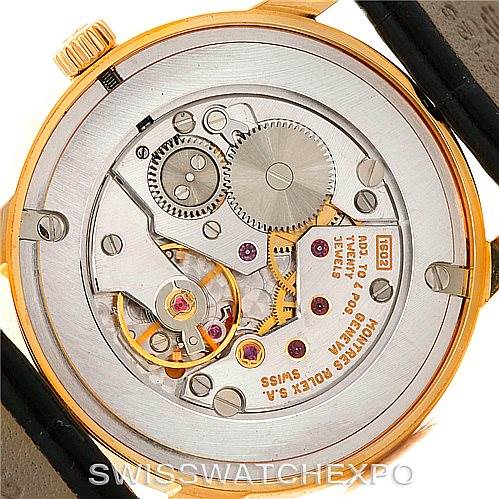 This image shows the back view of a Rolex Cellini 5116 Men's Yellow Gold Black Dial 5116 Men's Yellow Gold Black Dial model, highlighting its exposed movement and mechanical parts.