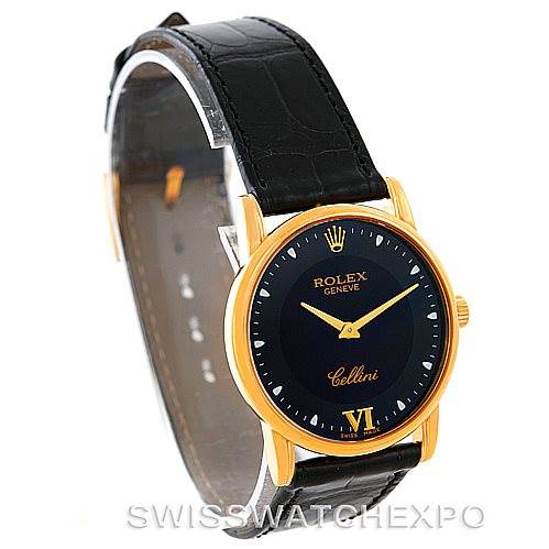 The Rolex Cellini 5116 Men's Yellow Gold Black Dial 5116 Men's Yellow Gold Black Dial watch is shown at a three-quarter angle, displaying its black dial, gold case, and black leather strap.