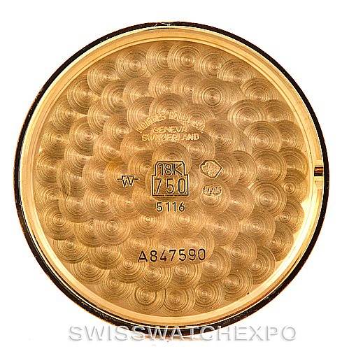 The image shows the inner case back of a Rolex Cellini 5116 Men's Yellow Gold Black Dial 5116 Men's Yellow Gold Black Dial watch, showcasing its gold content and serial numbers.