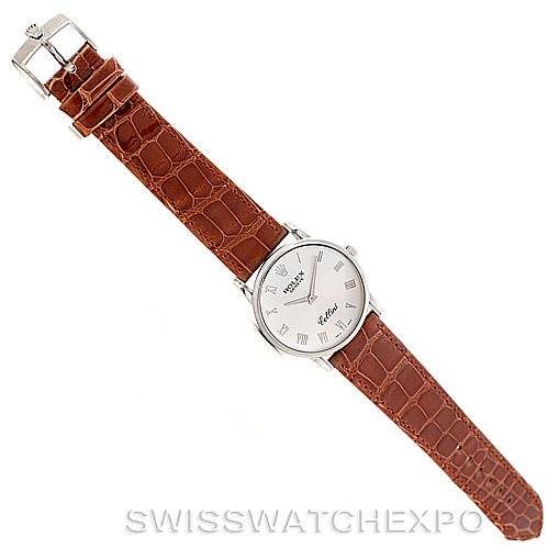 The image shows a top-down view of a Rolex Cellini 5116 Men's White Gold Silver Dial 5116 Men's White Gold Silver Dial watch with a brown leather strap.