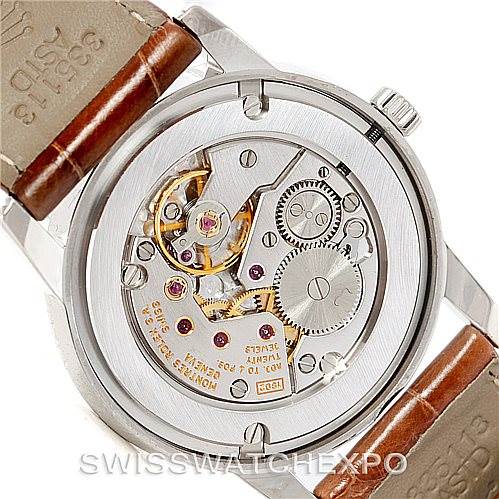The image shows the back of a Rolex Cellini 5116 Men's White Gold Silver Dial 5116 Men's White Gold Silver Dial watch, highlighting its intricate mechanical movement and leather straps.