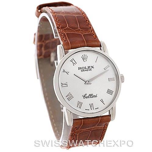 The Rolex Cellini 5116 Men's White Gold Silver Dial 5116 Men's White Gold Silver Dial watch is angled to show the face, bezel, crown, and brown leather strap.