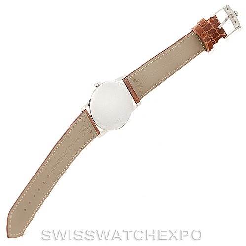 This image shows the underside of a Rolex Cellini 5116 Men's White Gold Silver Dial 5116 Men's White Gold Silver Dial watch with a brown leather strap and silver buckle.