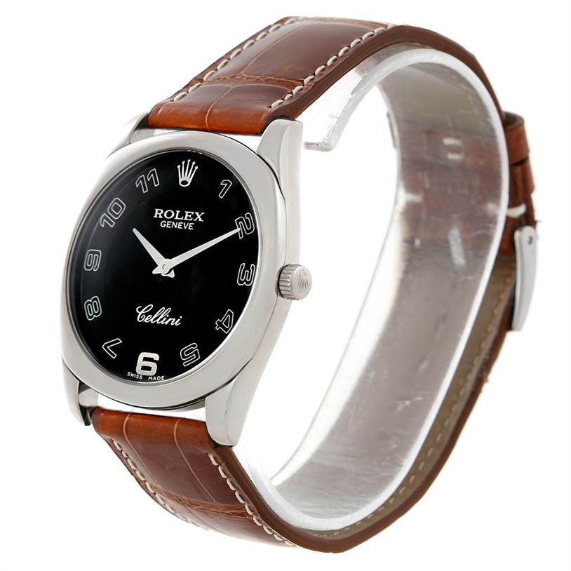 This image shows a Rolex Cellini 4233 Men's White Gold Black Dial 4233 Men's White Gold Black Dial watch at an angle highlighting its black dial, silver case, crown, and brown leather strap.