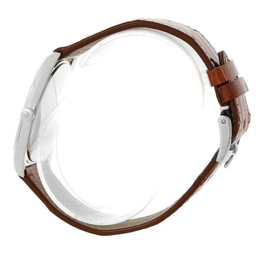 This image shows a side view of a Rolex Cellini 4233 Men's White Gold Black Dial 4233 Men's White Gold Black Dial watch, highlighting its profile, case, crown, and brown leather strap.