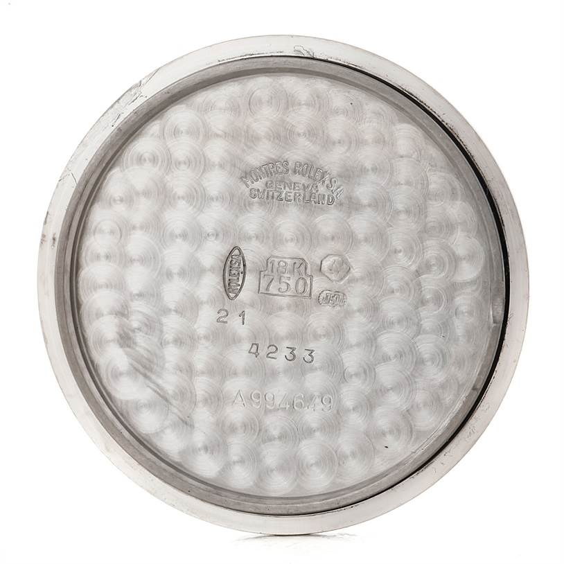 This image shows the inside of the case back of a Rolex Cellini 4233 Men's White Gold Black Dial 4233 Men's White Gold Black Dial watch, featuring engravings and hallmarking details.