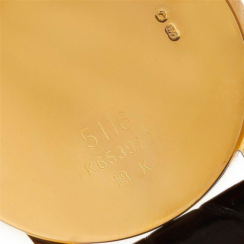 This image shows the case back of a Rolex Cellini 5116 Men's Yellow Gold Grey Dial 5116 Men's Yellow Gold Grey Dial watch, highlighting the model number, serial number, and 18K gold mark.