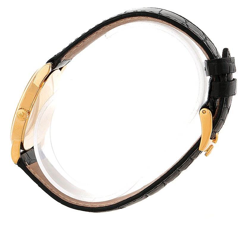 This image shows a side view of a Rolex Cellini 5116 Men's Yellow Gold Grey Dial 5116 Men's Yellow Gold Grey Dial watch, highlighting the gold case and black leather strap with a deployant clasp.