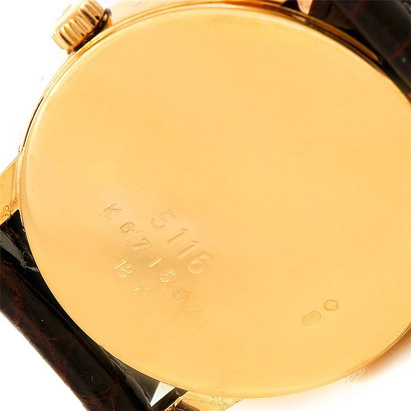 This image shows the back case and crown of a Rolex Cellini 5116 Men's Yellow Gold Grey Dial 5116 Men's Yellow Gold Grey Dial model watch.