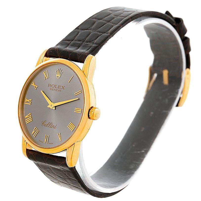 The image shows a Rolex Cellini 5116 Men's Yellow Gold Grey Dial 5116 Men's Yellow Gold Grey Dial watch at an angle displaying the face, bezel, crown, and strap.