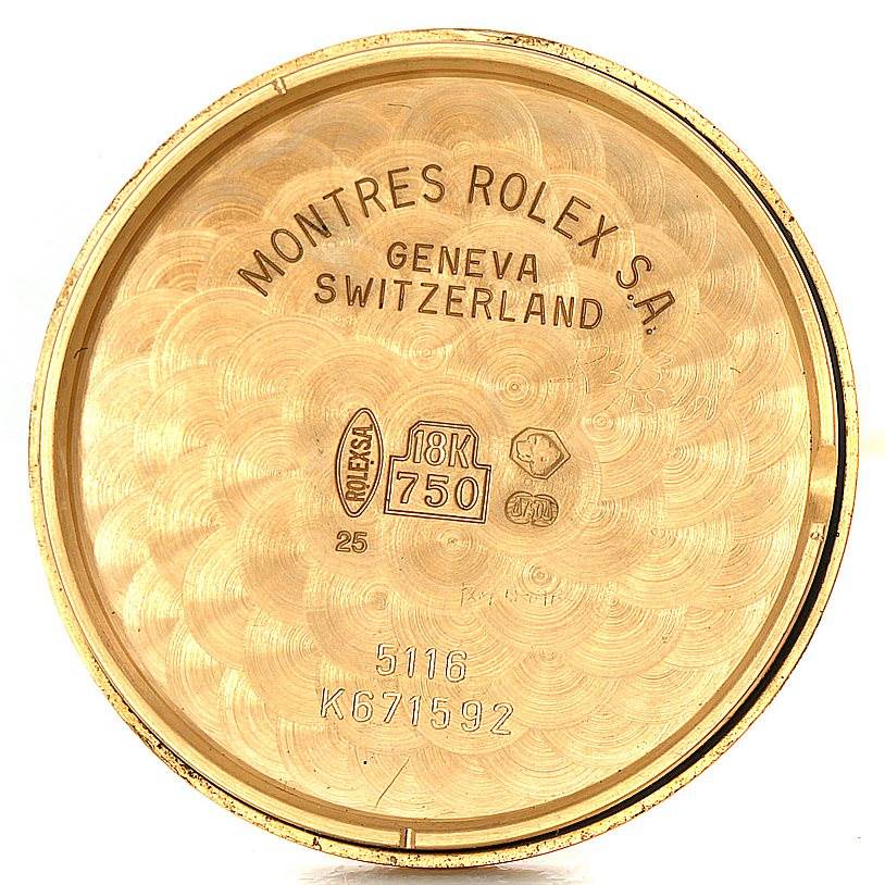 This image displays the inside of the back cover from a Rolex Cellini 5116 Men's Yellow Gold Grey Dial 5116 Men's Yellow Gold Grey Dial watch, detailing its gold purity and serial numbers.