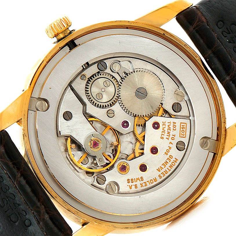 This image shows the internal mechanism and components of a Rolex Cellini 5116 Men's Yellow Gold Grey Dial 5116 Men's Yellow Gold Grey Dial watch from a back angle.