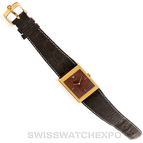 This image shows a full view of a Rolex Cellini 4127 Men
s Yellow Gold Brown Dial 4127 Men
s Yellow Gold Brown Dial watch with a brown leather strap laid flat.