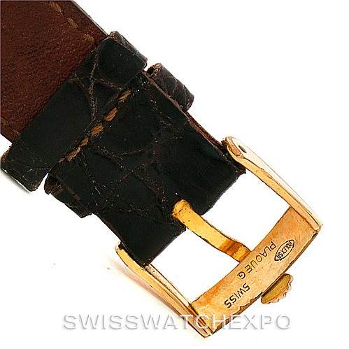 This image shows the buckle and leather strap of a Rolex Cellini 4127 Men
s Yellow Gold Brown Dial 4127 Men
s Yellow Gold Brown Dial watch from an angled top view.