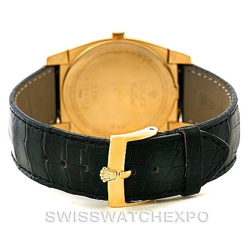 This image shows the back and clasp of a Rolex Cellini 5330 Men's Yellow Gold White Dial 5330 Men's Yellow Gold White Dial watch, highlighting its gold buckle and black leather strap.