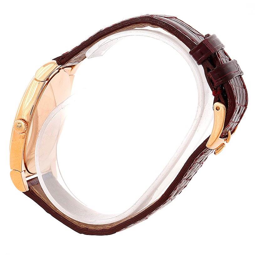 This side view angle shows the case, crown, and leather strap of the Rolex Cellini 5330 Men
s Rose Gold White Dial 5330 Men
s Rose Gold White Dial watch.