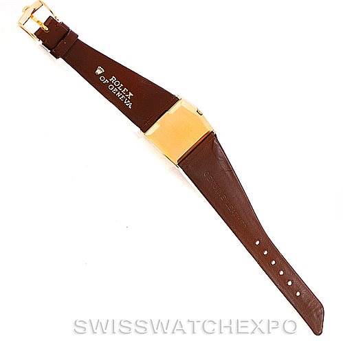 This image shows the back view of a Rolex Cellini 4017 Men's Yellow Gold Champagne Dial 4017 Men's Yellow Gold Champagne Dial watch with its brown leather strap, gold buckle, and gold case.