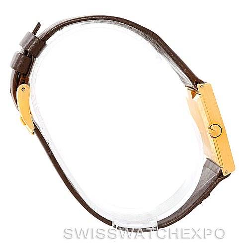 This image shows a side view of a Rolex Cellini 4017 Men's Yellow Gold Champagne Dial 4017 Men's Yellow Gold Champagne Dial watch, highlighting its rectangular gold case and brown leather strap.