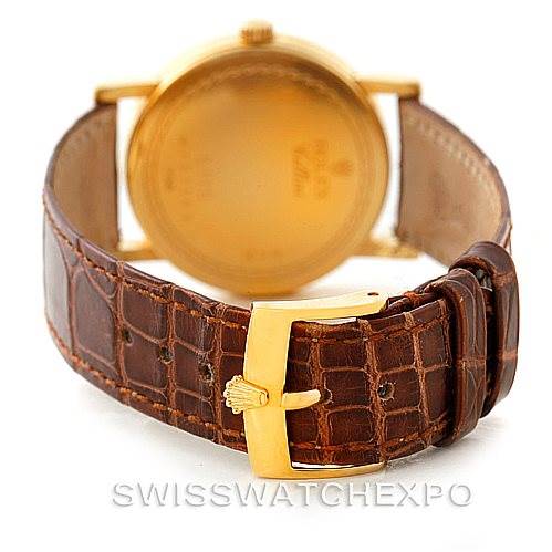 This image shows the back view of a Rolex Cellini 5115 Men's Yellow Gold Mother of Pearl Dial 5115 Men's Yellow Gold Mother of Pearl Dial watch with a focus on its brown leather strap and gold buckle.