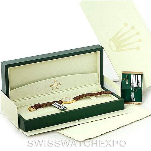 The image displays a Rolex Cellini 5115 Men's Yellow Gold Mother of Pearl Dial 5115 Men's Yellow Gold Mother of Pearl Dial watch in its original open box, alongside the warranty card and a cleaning cloth.