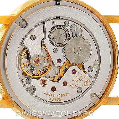 This image shows a close-up view of the movement of a Rolex Cellini 5115 Men's Yellow Gold Mother of Pearl Dial 5115 Men's Yellow Gold Mother of Pearl Dial watch, revealing its internal mechanical components.