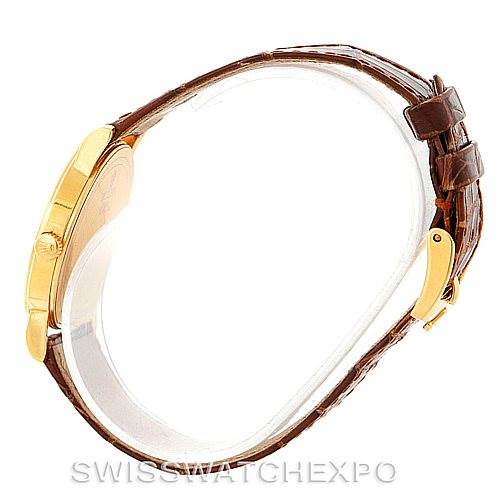 This image shows a side profile of a Rolex Cellini 5115 Men's Yellow Gold Mother of Pearl Dial 5115 Men's Yellow Gold Mother of Pearl Dial watch, highlighting the gold case, crown, and brown leather strap with buckle.