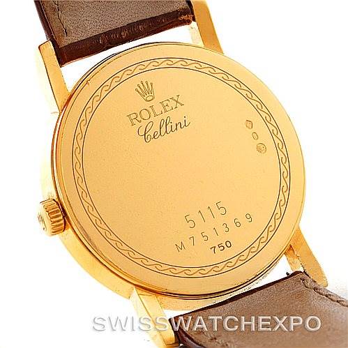 This image shows the back case of a Rolex Cellini 5115 Men's Yellow Gold Mother of Pearl Dial 5115 Men's Yellow Gold Mother of Pearl Dial watch, highlighting the engraved details, crown, and leather strap.