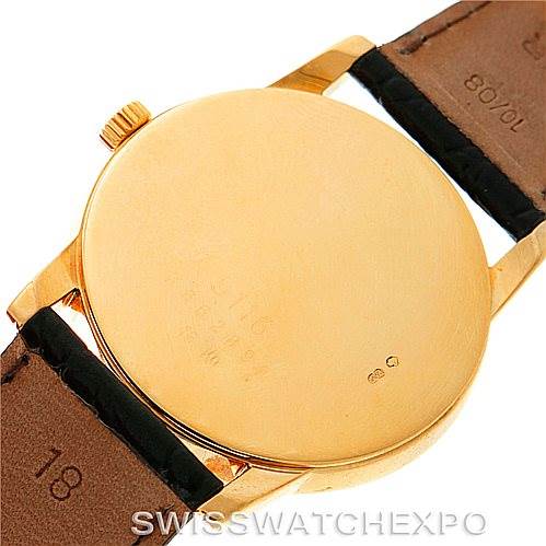 The image shows the back case of a Rolex Cellini 5116 Men's Yellow Gold Black Dial 5116 Men's Yellow Gold Black Dial watch with the leather bands partially visible.