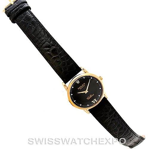 This image displays a Rolex Cellini 5116 Men's Yellow Gold Black Dial 5116 Men's Yellow Gold Black Dial watch from a top-down angle, featuring the entire watch strap and face.