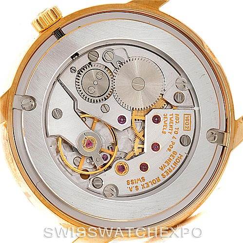 The image shows the back view of a Rolex Cellini 5116 Men's Yellow Gold Black Dial 5116 Men's Yellow Gold Black Dial model watch, revealing its intricate internal mechanical components.
