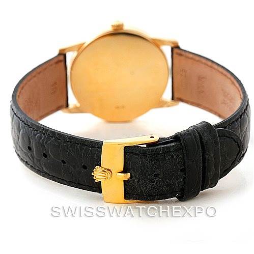 The image shows the back of a Rolex Cellini 5116 Men's Yellow Gold Black Dial 5116 Men's Yellow Gold Black Dial watch, highlighting its leather strap and gold clasp.