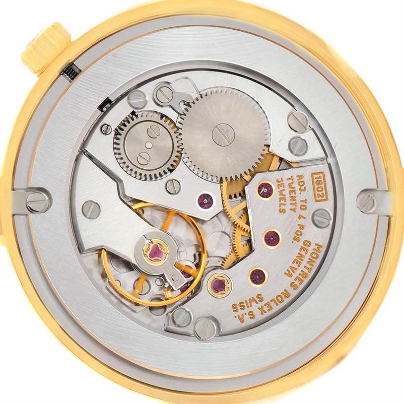 This image shows an internal view of the Rolex Cellini 5116 Men's Yellow Gold Grey Dial 5116 Men's Yellow Gold Grey Dial model, focusing on the intricate mechanical movement and gears.