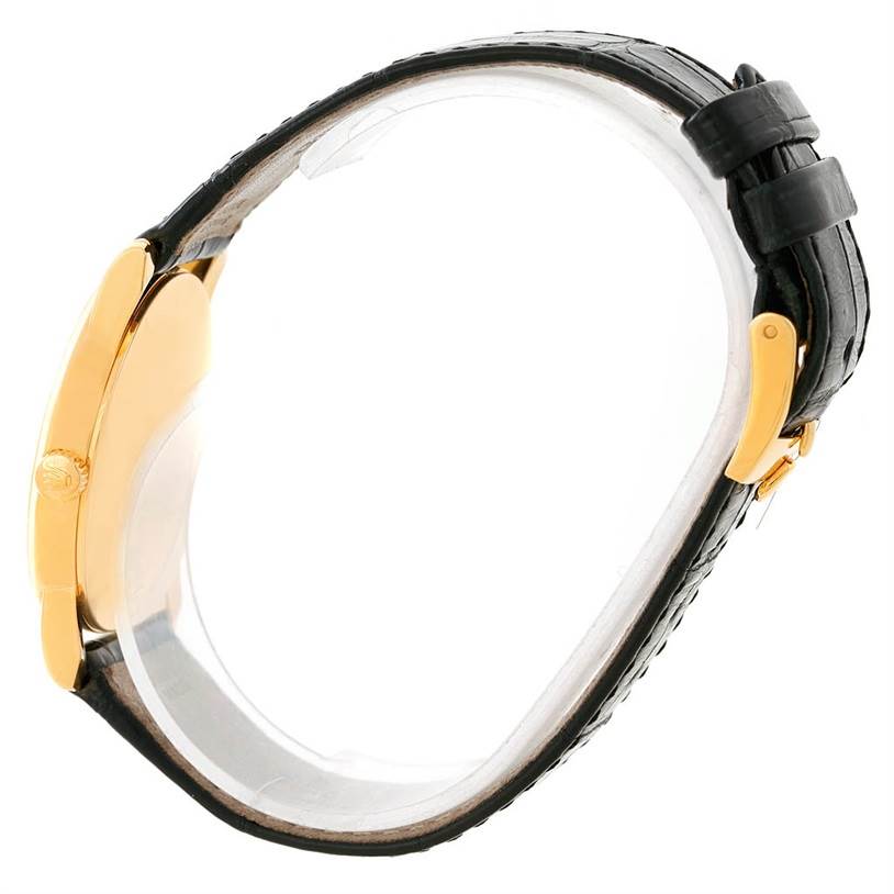 The image shows a side view of the Rolex Cellini 5116 Men's Yellow Gold Grey Dial 5116 Men's Yellow Gold Grey Dial watch with a gold case and black leather strap.