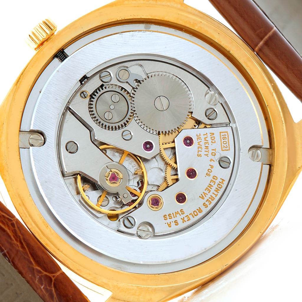 This image shows the back view of a Rolex Cellini 4233 Men's Yellow Gold Black Dial 4233 Men's Yellow Gold Black Dial watch, revealing its internal mechanical movement.