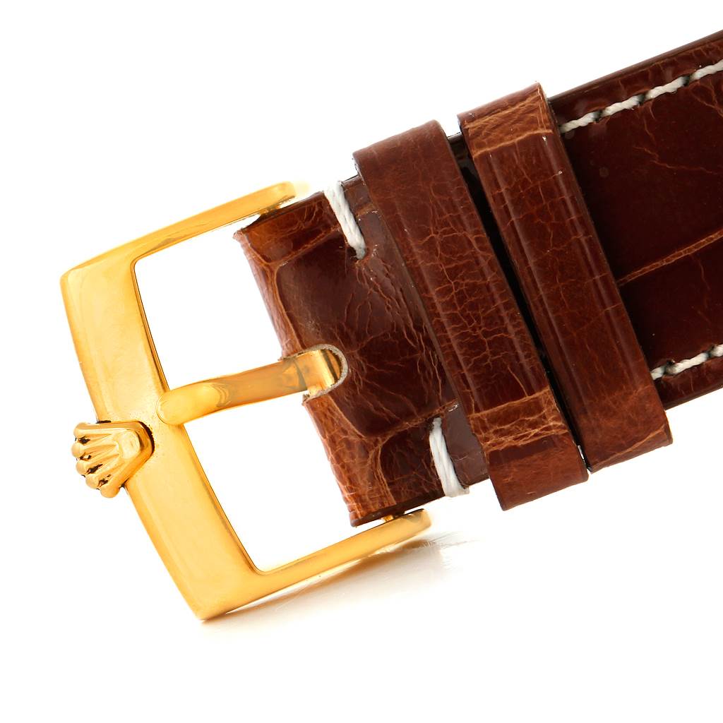 The image shows the buckle and part of the brown leather strap of a Rolex Cellini 4233 Men's Yellow Gold Black Dial 4233 Men's Yellow Gold Black Dial watch.