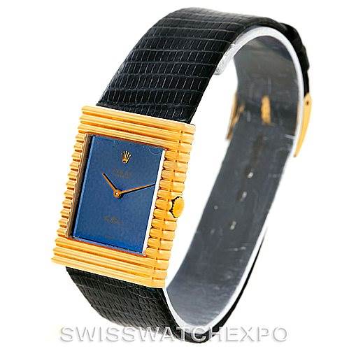 This image shows a Rolex Cellini 4012 Men's Yellow Gold Blue Dial 4012 Men's Yellow Gold Blue Dial watch at a slight angle, displaying its gold rectangular case, blue dial, and black leather strap.